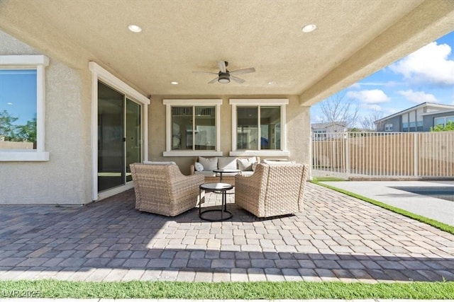 view of patio featuring fence, ceiling fan, and an outdoor hangout area