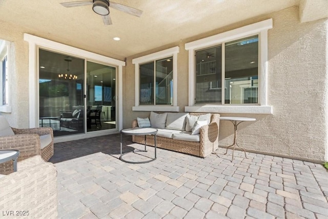 view of patio / terrace with a ceiling fan and an outdoor living space