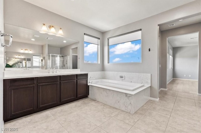 3062 Echoed Rondel Ln, Henderson, NV 89044 - bathroom featuring healthy amount of natural light, a bath, and a shower stall
