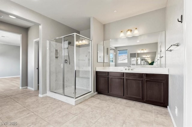 3062 Echoed Rondel Ln, Henderson, NV 89044 - bathroom featuring a shower stall, vanity, and tile patterned flooring
