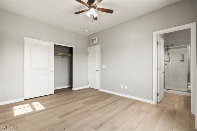 3062 Echoed Rondel Ln, Henderson, NV 89044 - unfurnished bedroom with light wood-type flooring, a closet, ensuite bath, and ceiling fan