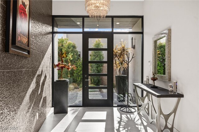 387 Solitude Peak Ln, Henderson, NV 89012 - entryway with tile patterned floors and a chandelier