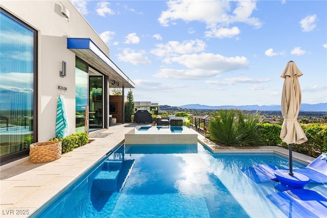 387 Solitude Peak Ln, Henderson, NV 89012 - outdoor pool featuring a mountain view and a patio area