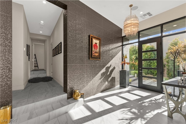 387 Solitude Peak Ln, Henderson, NV 89012 - interior space with visible vents, tile walls, stairway, recessed lighting, and a chandelier