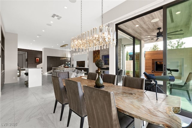 387 Solitude Peak Ln, Henderson, NV 89012 - dining space with recessed lighting, visible vents, ceiling fan with notable chandelier, and marble finish floor
