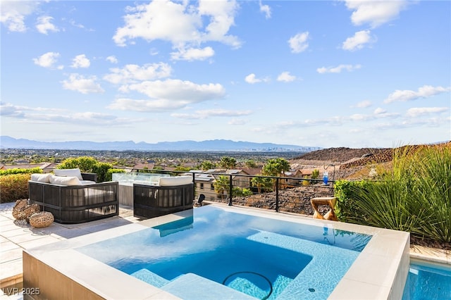 387 Solitude Peak Ln, Henderson, NV 89012 - view of pool with an outdoor hot tub and a mountain view