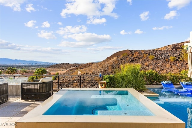 387 Solitude Peak Ln, Henderson, NV 89012 - view of pool with a fenced in pool, a jacuzzi, and a mountain view
