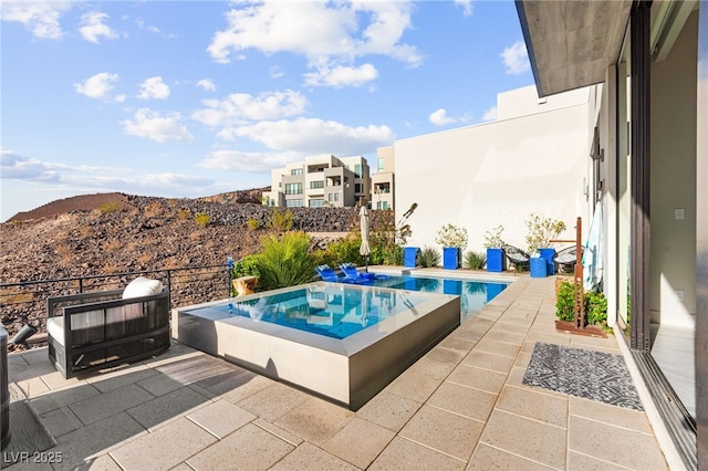387 Solitude Peak Ln, Henderson, NV 89012 - view of pool featuring a hot tub, a mountain view, and a patio area