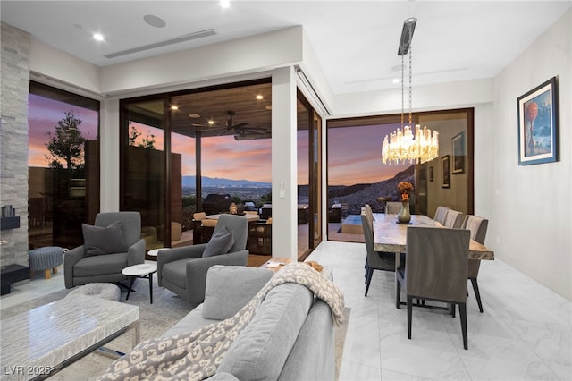 387 Solitude Peak Ln, Henderson, NV 89012 - dining room featuring ceiling fan with notable chandelier