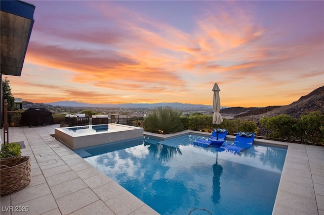 387 Solitude Peak Ln, Henderson, NV 89012 - pool featuring a patio, an in ground hot tub, and a mountain view