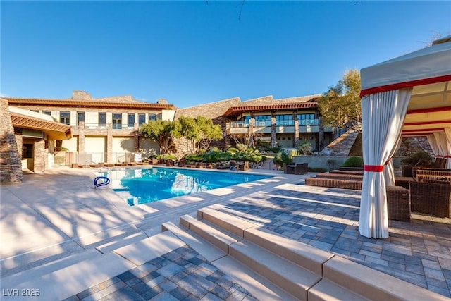 387 Solitude Peak Ln, Henderson, NV 89012 - outdoor pool featuring a patio area