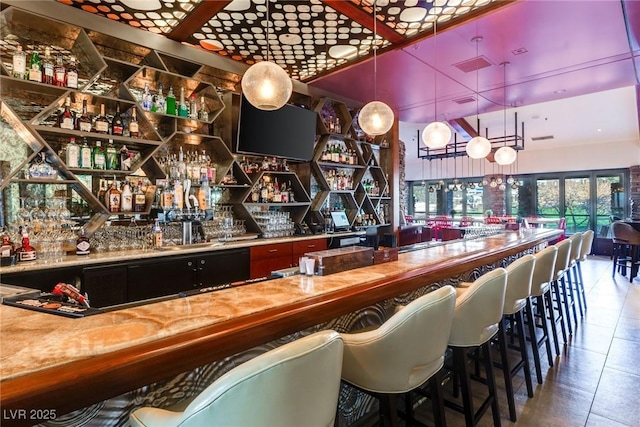 387 Solitude Peak Ln, Henderson, NV 89012 - bar with tile patterned flooring and indoor wet bar