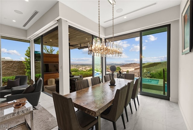 387 Solitude Peak Ln, Henderson, NV 89012 - dining space with visible vents, a notable chandelier, recessed lighting, and marble finish floor