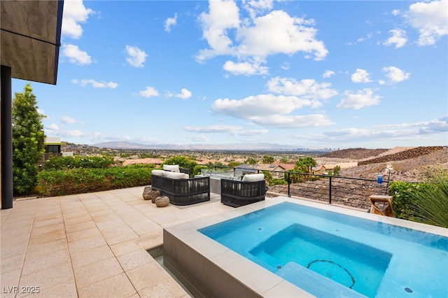 387 Solitude Peak Ln, Henderson, NV 89012 - view of swimming pool featuring an outdoor hot tub, a mountain view, and a patio area