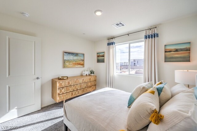 carpeted bedroom with visible vents