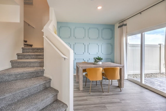 dining area with recessed lighting, stairs, and light wood finished floors