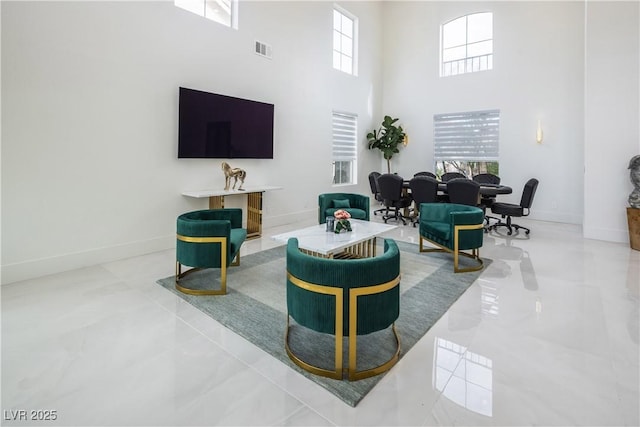 8000 Clock Tower Ct, Las Vegas, NV 89117 - living area featuring a towering ceiling and healthy amount of natural light