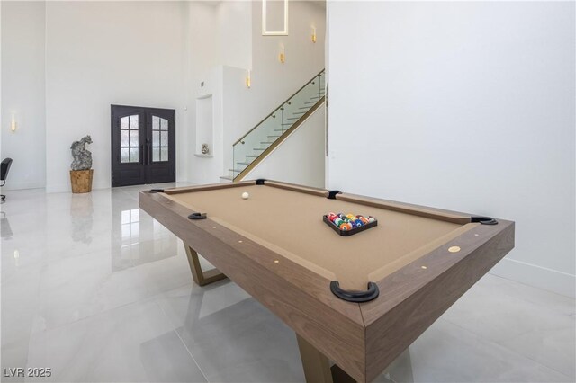 rec room featuring french doors, billiards table, a high ceiling, and baseboards