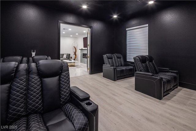 8000 Clock Tower Ct, Las Vegas, NV 89117 - home theater with wood finished floors, recessed lighting, and a textured wall