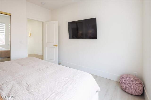 bedroom featuring baseboards