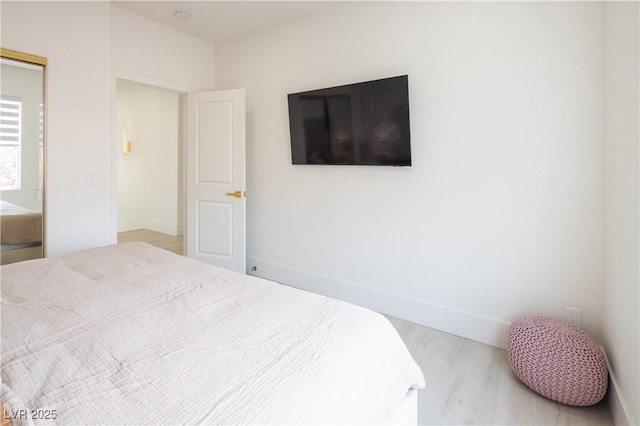 8000 Clock Tower Ct, Las Vegas, NV 89117 - bedroom featuring baseboards and wood finished floors
