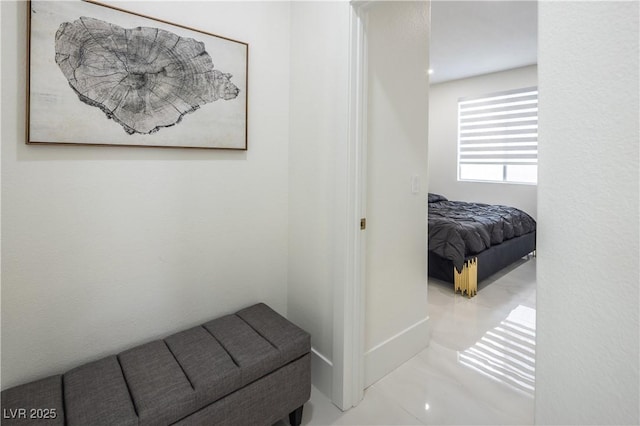 corridor featuring baseboards