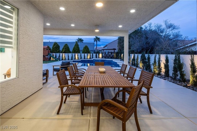 view of patio / terrace with outdoor dining space and fence