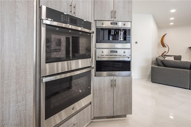 kitchen with double oven, open floor plan, and light tile patterned flooring