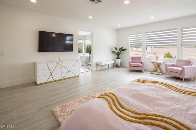 living area with plenty of natural light, wood finished floors, baseboards, and recessed lighting