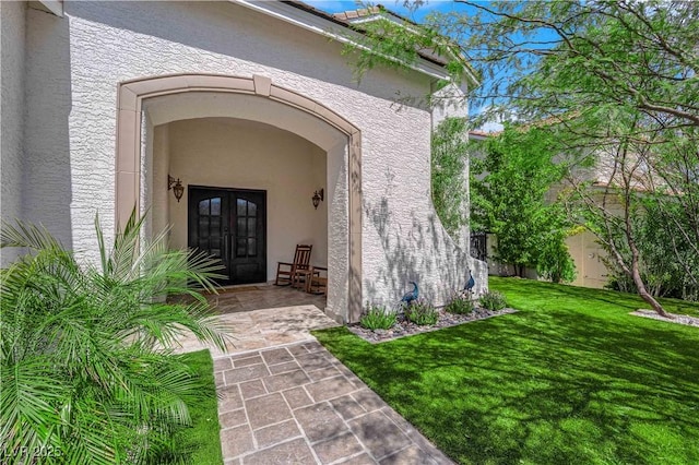 8000 Clock Tower Ct, Las Vegas, NV 89117 - entrance to property featuring french doors, stucco siding, and a lawn