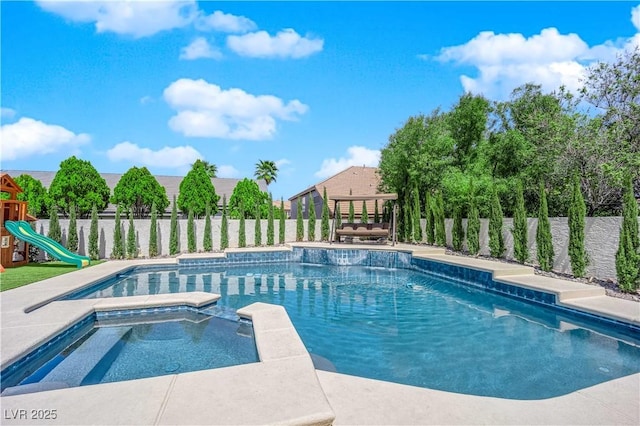 8000 Clock Tower Ct, Las Vegas, NV 89117 - view of swimming pool with a fenced backyard and a pool with connected hot tub