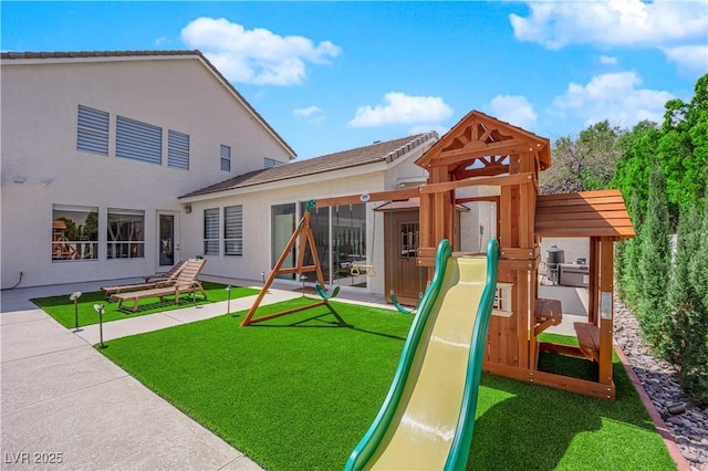 view of play area with a lawn
