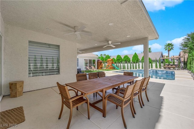 8000 Clock Tower Ct, Las Vegas, NV 89117 - view of patio / terrace featuring a playground, a ceiling fan, and outdoor dining area