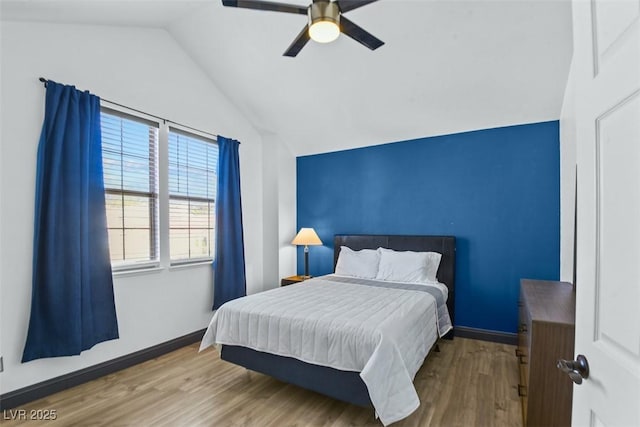 9709 Terrace Green Ave, Las Vegas, NV 89117 - bedroom with lofted ceiling, a ceiling fan, wood finished floors, and baseboards
