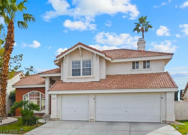9709 Terrace Green Ave, Las Vegas, NV 89117 - view of front facade with an attached garage, a tile roof, and concrete driveway
