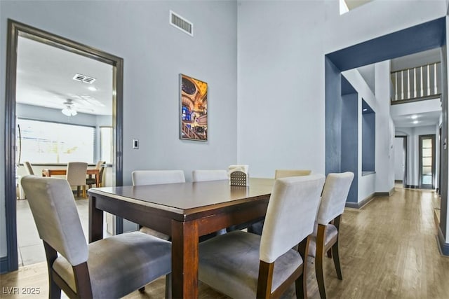 9709 Terrace Green Ave, Las Vegas, NV 89117 - dining space with baseboards, wood finished floors, and visible vents