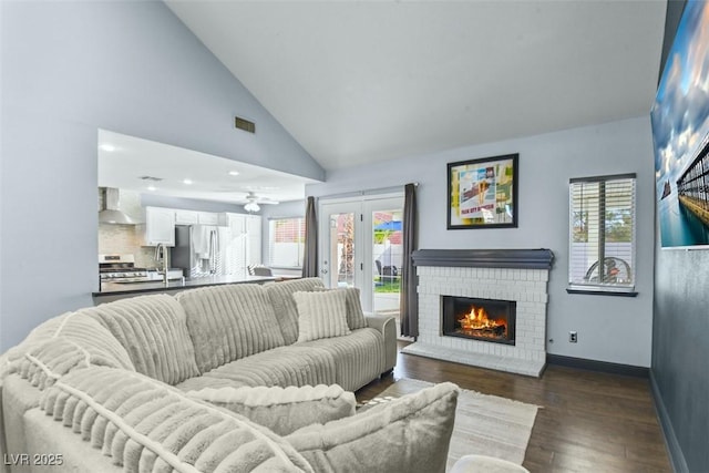 9709 Terrace Green Ave, Las Vegas, NV 89117 - living room featuring baseboards, dark wood-style floors, a fireplace, and a healthy amount of sunlight