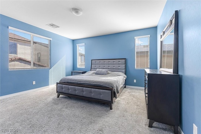 bedroom with visible vents, baseboards, and carpet floors