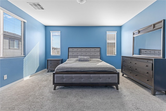 bedroom with baseboards, carpet, and visible vents
