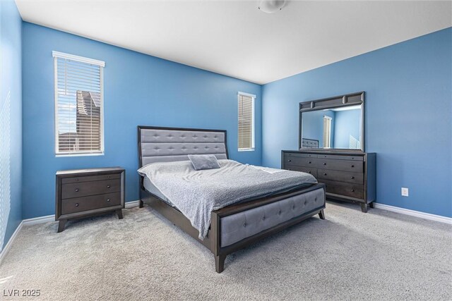 carpeted bedroom with baseboards