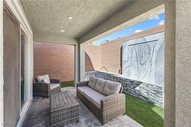 view of patio / terrace featuring a fenced backyard and an outdoor living space
