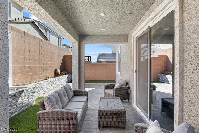 view of patio featuring a fenced backyard and an outdoor hangout area