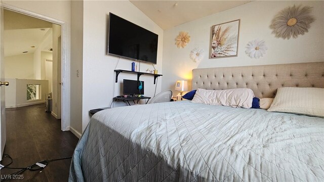 3871 Sir Bret Ct, Las Vegas, NV 89104 - bedroom featuring wood finished floors, baseboards, and lofted ceiling
