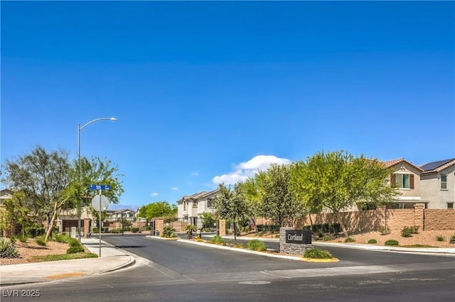 415 Carsin Wayne Ct, North Las Vegas, NV 89031 - view of asphalt street featuring a residential view, sidewalks, and curbs