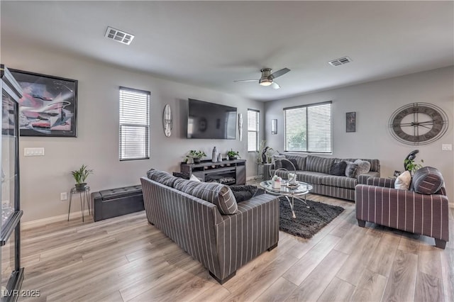 415 Carsin Wayne Ct, North Las Vegas, NV 89031 - living area with ceiling fan, light wood finished floors, and baseboards