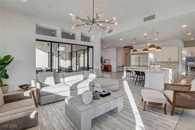12199 Canyon Sunset St, Las Vegas, NV 89138 - living area featuring an inviting chandelier, visible vents, and recessed lighting