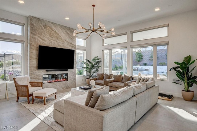 12199 Canyon Sunset St, Las Vegas, NV 89138 - living area featuring light tile patterned floors, baseboards, recessed lighting, and an inviting chandelier