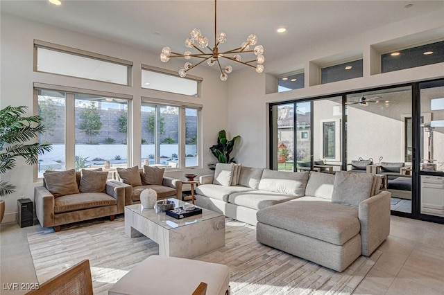 12199 Canyon Sunset St, Las Vegas, NV 89138 - living area with a high ceiling, recessed lighting, and an inviting chandelier