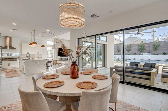 12199 Canyon Sunset St, Las Vegas, NV 89138 - dining room with a healthy amount of sunlight, an inviting chandelier, visible vents, and recessed lighting