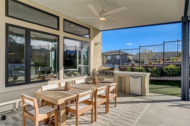12199 Canyon Sunset St, Las Vegas, NV 89138 - view of patio featuring area for grilling, outdoor dining space, ceiling fan, and fence